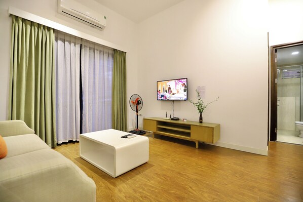 Deluxe Apartment, 1 Bedroom, City View | Desk, laptop workspace, blackout drapes, free WiFi