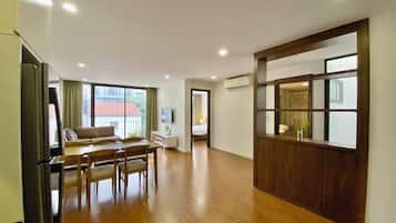 Deluxe Apartment, 2 Bedrooms, City View | In-room safe, desk, laptop workspace, blackout drapes