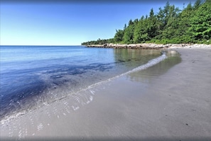 Private beach, white sand, beach umbrellas, beach towels