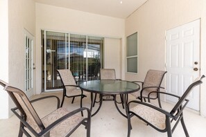 Outdoor dining - NEW! Modern Villa w/ South-Facing Pool, Spa & Game Room Near Disney (Kissimmee)