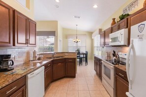 Fridge, microwave, dishwasher, coffee/tea maker - NEW! Modern Villa w/ South-Facing Pool, Spa & Game Room Near Disney (Kissimmee)