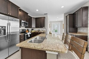 Fridge, microwave, dishwasher, coffee/tea maker - NEW! Elegant 8BR Retreat w/ Private Pool, Spa & Family-Friendly Comfort (Kissimmee)