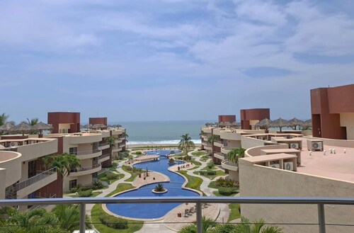 Luxury Beachfront Escape, 3BR Condo + 1500 sqft Patio