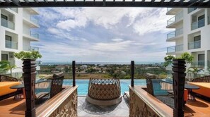 A rooftop terrace with a pool, seating, and a view of the landscape. - Apec Phú Yên-Sunsea House (Tuy Hoa)