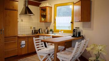 Fridge, stovetop, dishwasher, coffee/tea maker