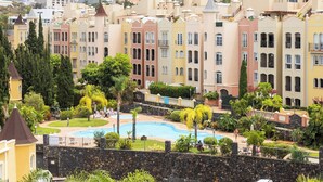 A resort with colorful buildings, a swimming pool, and lush landscaping. - Home2Book Serenity Terrace & Pool, La Quinta (Tenerife)