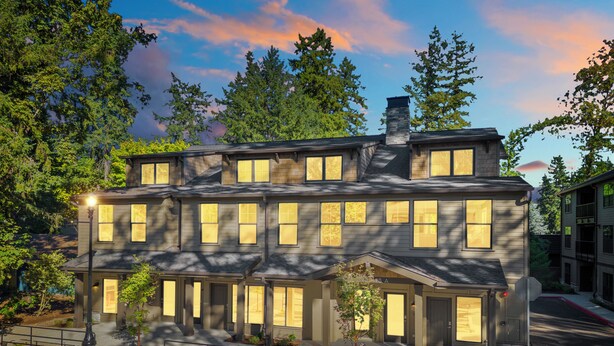 A multi-story building with a symmetrical facade, large windows, and a central entrance. - Lake Oswego Quiet Ground Level Condo Private Entrance - Pet Friendly! (Lake Oswego)