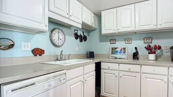 Condo, 1 King Bed with Sofa bed, Patio, Ocean View (Cottage By The Sea 146) | Private kitchen | Coffee/tea maker, dining tables