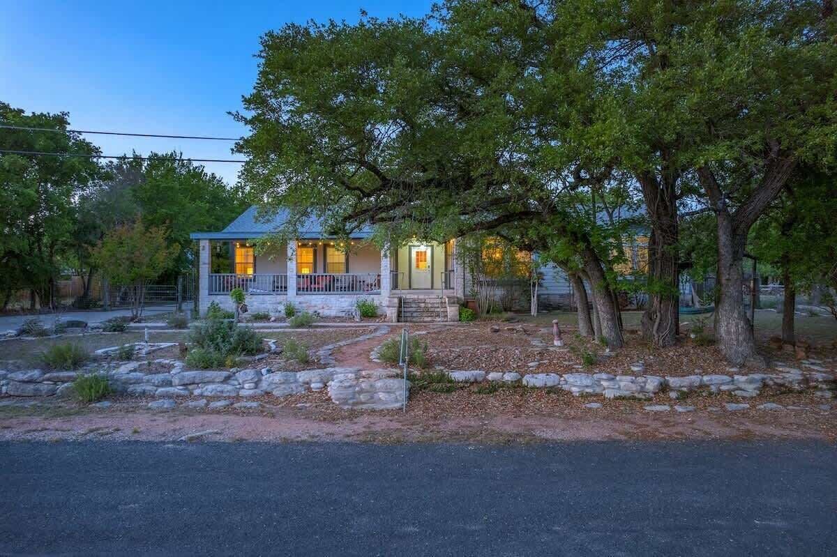 A house with a porch, a front door, and a driveway.