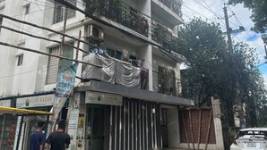 A multi-story building with balconies, a storefront, and a parked car. - Specious Wonderful 2 AC & 2 NON AC bedroom apartment in West Khulshi,Chittagong (Chittagong)