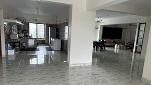 A spacious living area with a marble floor, a dining table, and a sofa. - Specious Wonderful 2 AC & 2 NON AC bedroom apartment in West Khulshi,Chittagong (Chittagong)