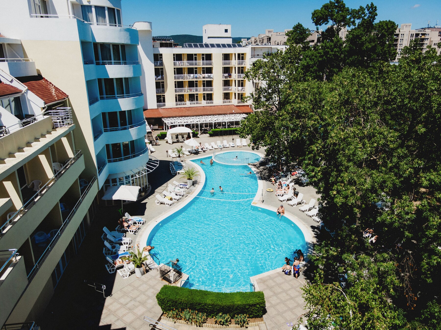 Seasonal outdoor pool, open 8:00 AM to 8:00 PM, pool umbrellas