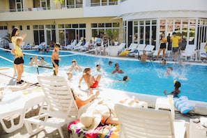 Seasonal outdoor pool, open 8:00 AM to 8:00 PM, pool umbrellas