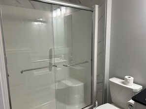 Shower, towels, soap, toilet paper