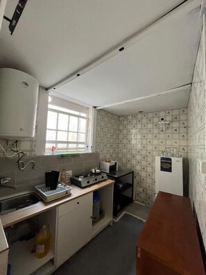 Fridge, microwave, stovetop, cookware/dishes/utensils