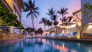 Outdoor pool, open 9:00 AM to 9:00 PM, pool umbrellas, pool loungers