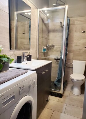 Shower, hair dryer, towels, soap