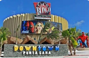 A building with a sign that reads "Downtown Punta Cana" and "Coco Bongo Show & Disco." - Punta Cana Beach Retreat-Costa Bavaro (Punta Cana)