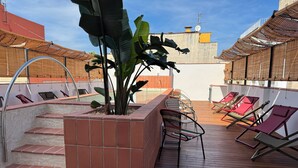 A rooftop terrace with a pool, steps leading to the pool, and several lounge chairs. - BELLADORA HOTEL BOUTIQUE (Lloret de Mar)