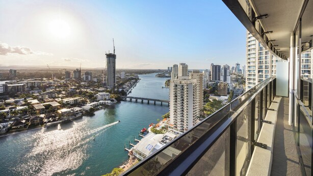 A high-rise building with a view of a river and other buildings. - Circle on Cavill Level 23 River View (Surfers Paradise)