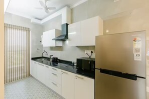 Superior Apartment, Pool View | Private kitchen | Toaster, blender, dining tables
