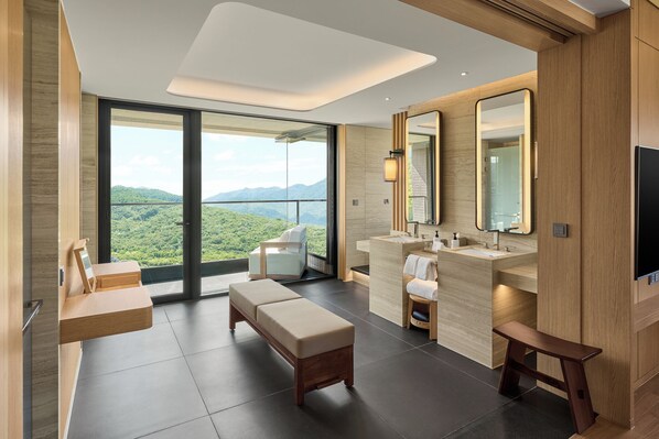 A modern bathroom with a large window, a bench, a sink, and a mirror. - Intercontinental New Taipei Hot Spring by IHG (New Taipei City)
