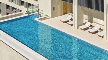 Outdoor pool, sun loungers, lifeguards on site