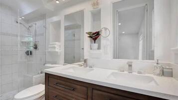 Shower, towels, soap, toilet paper