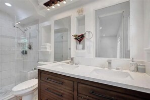 Shower, towels, soap, toilet paper