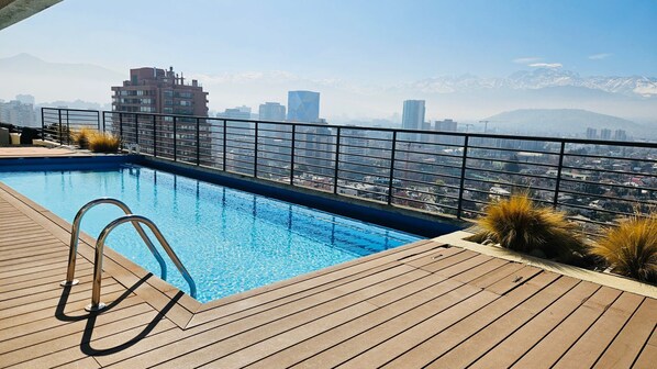Seasonal outdoor pool, open 8:30 AM to 8:30 PM, pool umbrellas