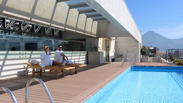 Seasonal outdoor pool, open 8:30 AM to 8:30 PM, pool umbrellas