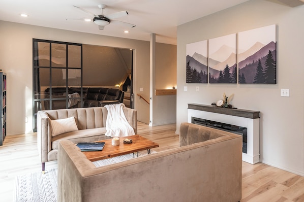 Smart TV, fireplace, table football, books