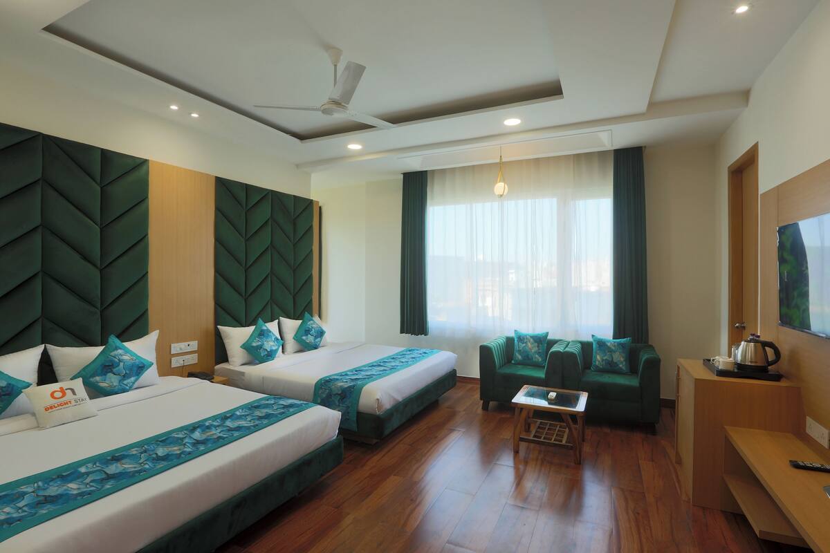 Deluxe Quadruple Room, City View | In-room safe, desk, laptop workspace, soundproofing