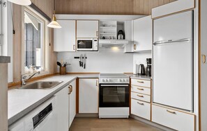 Fridge, stovetop, dishwasher, coffee/tea maker