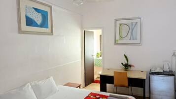 Desk, laptop workspace, iron/ironing board (on request), bed sheets