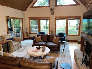 Smart TV, fireplace, books, computer monitors