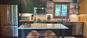 3-bedroom modern mid century cabin! 
Hot tub, fire pit and lake front