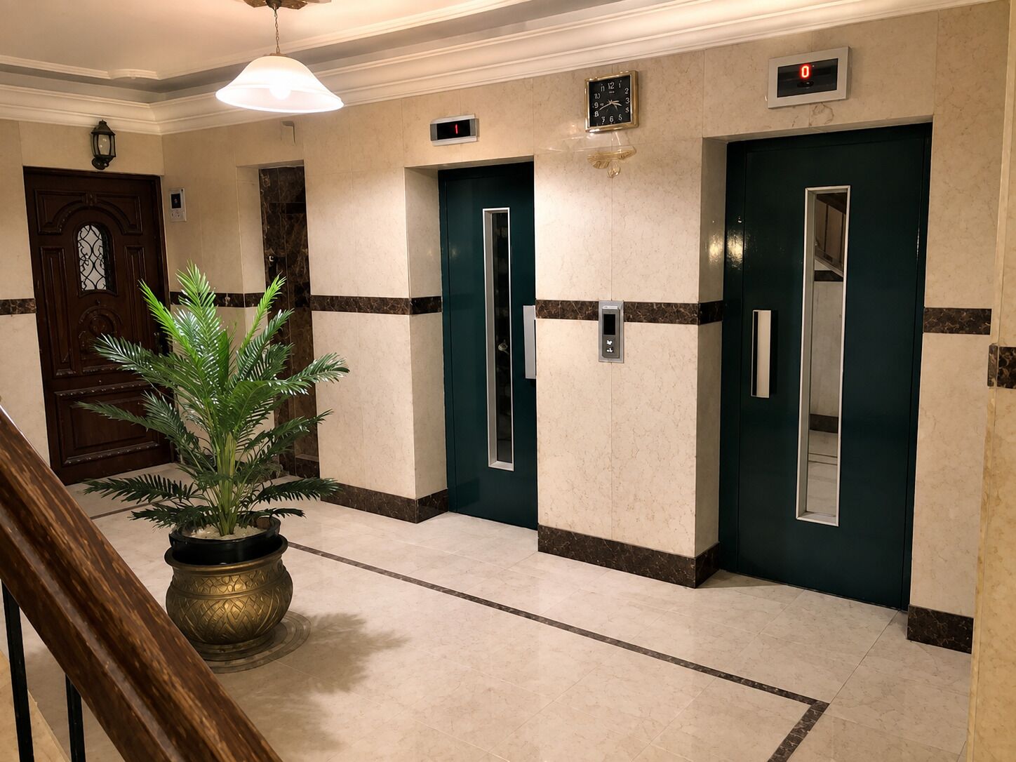 A hallway with three elevator doors, a potted plant, and a staircase.