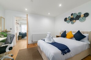 1 bedroom, desk, iron/ironing board, travel crib