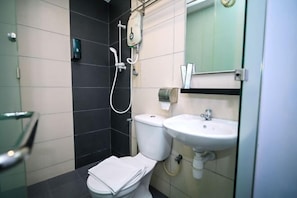 A bathroom with a toilet, a sink, and a shower. - Swing & Pillows @ Rawang Selangor (Rawang)
