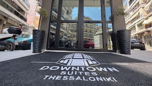 A hotel entrance with a sign reading "Downtown Suites Thessaloniki". - Downtown Suites (Thessaloniki)