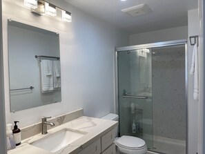 Shower, hair dryer, towels, soap