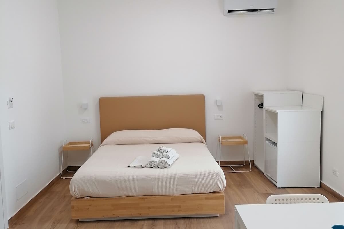 Superior Quadruple Room, Balcony, Courtyard View | Minibar, travel crib, WiFi (free), bed sheets