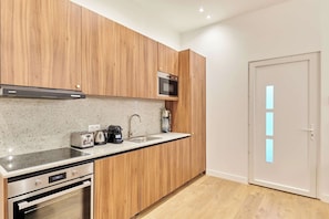 Fridge, microwave, stovetop, coffee/tea maker