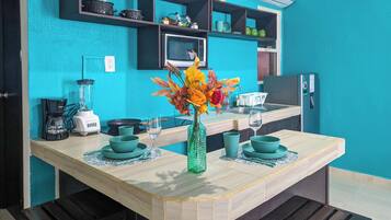 Fridge, microwave, stovetop, coffee/tea maker
