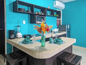 Fridge, microwave, stovetop, coffee/tea maker