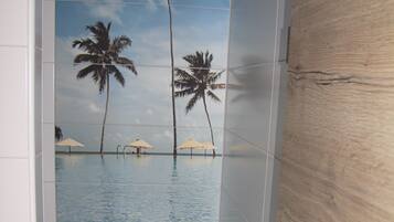 Shower, hair dryer, slippers, towels