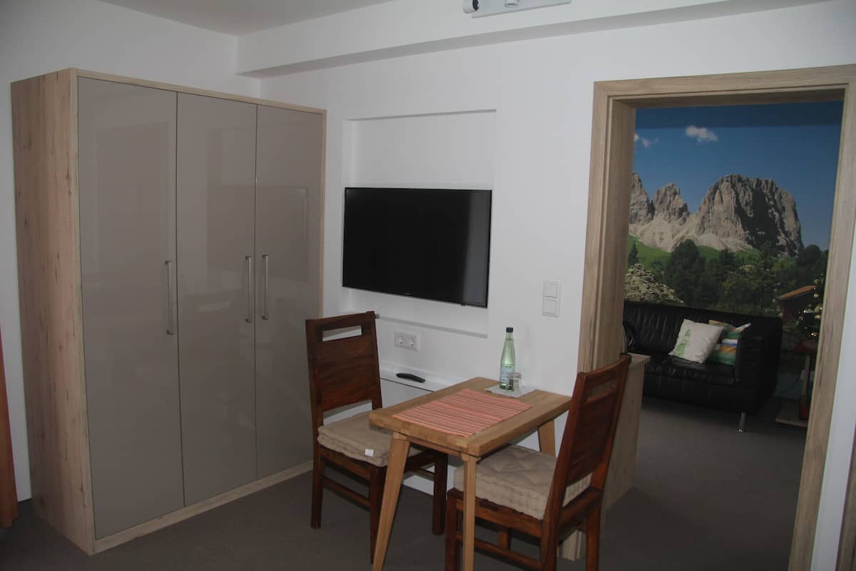 Hypo-allergenic bedding, desk, laptop workspace, blackout curtains