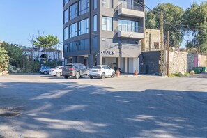A multi-story building with a sign reading "GATE9" at the entrance. - Gate 9 Tower -Studios & Apts Mar Mikhael (Beirut)