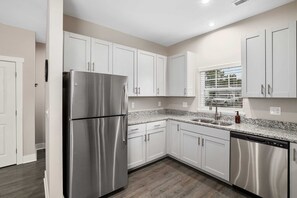 Fridge, microwave, oven, stovetop - Modern 2BR + 2BA Condo with Garage & Patio (Wyoming)